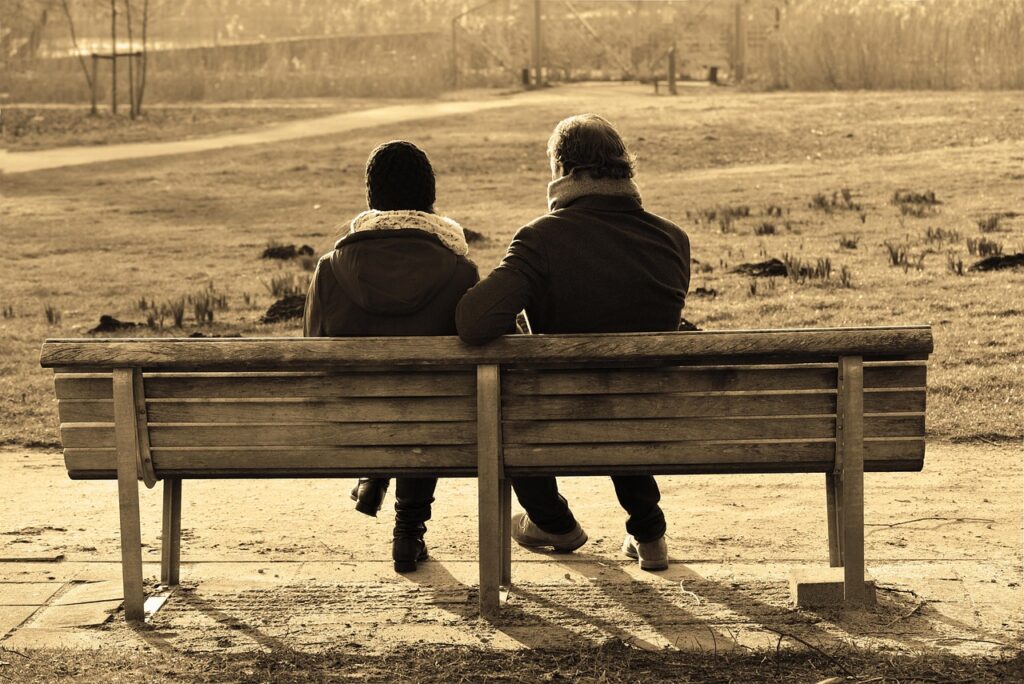 Couple having a conversation about automatic reactions in relationships.